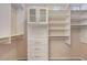 Walk-in closet featuring custom white shelving, drawers and plenty of space at 7856 Carysford Ave, Las Vegas, NV 89178