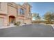 Charming townhouse with stucco exterior, well-maintained landscaping, and a private garage at 7856 Carysford Ave, Las Vegas, NV 89178