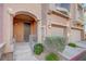 Charming front entrance with well-manicured landscaping and an attached two-car garage at 7856 Carysford Ave, Las Vegas, NV 89178