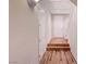 Bright hallway features hardwood floors, white walls, and a staircase leading to the upper level at 7856 Carysford Ave, Las Vegas, NV 89178