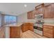Modern kitchen with stainless appliances, granite counters, and sleek wood floors at 7856 Carysford Ave, Las Vegas, NV 89178