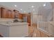 Bright kitchen with stainless appliances, granite counters, and wood floors throughout at 7856 Carysford Ave, Las Vegas, NV 89178