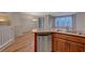 A modern kitchen with stainless steel appliances, granite countertops, and wood flooring provides style and function at 7856 Carysford Ave, Las Vegas, NV 89178