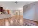A spacious living room with wood floors connects the living, dining, and kitchen areas, perfect for Gathering and entertaining at 7856 Carysford Ave, Las Vegas, NV 89178