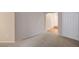 Cozy carpeted room with access to the entry hallway and a glimpse of the front door at 7856 Carysford Ave, Las Vegas, NV 89178