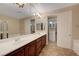 Main bathroom boasting dual sinks, soaking tub, large mirrors and access to a walk-in closet at 7856 Carysford Ave, Las Vegas, NV 89178