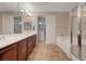 Main bathroom boasting dual vanities, a soaking tub, and a separate glass-enclosed shower, offering a spa-like experience at 7856 Carysford Ave, Las Vegas, NV 89178
