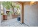 Enclosed patio area featuring stone flooring and landscaping views of the neighborhood at 7856 Carysford Ave, Las Vegas, NV 89178
