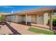 Rear home view featuring a covered patio and brick-paved walkway at 819 Sandsprings St, Henderson, NV 89011