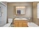 Bathroom featuring a vanity with a large mirror, a shower, and a bathtub with brass fixtures at 819 Sandsprings St, Henderson, NV 89011