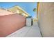 Side yard featuring a storage shed and block wall at 819 Sandsprings St, Henderson, NV 89011
