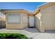 Charming single-story house with landscaped front yard and two car garage on a sunny day at 819 Sandsprings St, Henderson, NV 89011