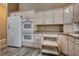 Spacious kitchen featuring recessed-panel cabinets, double ovens, and a large refrigerator at 819 Sandsprings St, Henderson, NV 89011