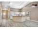 Spacious open-concept kitchen with an eat-in island, track lighting, and ample cabinet space at 819 Sandsprings St, Henderson, NV 89011