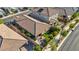 Overhead photo displays the roof, patio furniture, landscaped backyard, and surrounding neighborhood layout at 8346 Vinamala Ave, Las Vegas, NV 89149