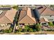 Bird's-eye view of a residence, highlighting the tile roof, backyard patio set, and proximity to neighborhood amenities at 8346 Vinamala Ave, Las Vegas, NV 89149