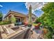 Inviting backyard with a seating area, fire pit, and lush landscaping at 8346 Vinamala Ave, Las Vegas, NV 89149
