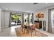 Dining area with backyard access showcases a table perfect for entertaining and decorative art at 8346 Vinamala Ave, Las Vegas, NV 89149