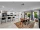 Bright dining area connects to the kitchen and features a large dining table and plenty of natural light at 8346 Vinamala Ave, Las Vegas, NV 89149
