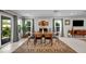 Open dining area features large windows with backyard views, creating a serene dining experience at 8346 Vinamala Ave, Las Vegas, NV 89149