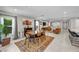 Spacious living area offers a blend of dining and lounge spaces with stylish decor and natural light at 8346 Vinamala Ave, Las Vegas, NV 89149