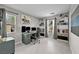 Bright office area with built-in shelves, multiple light sources, and dual monitors for a productive workspace at 8346 Vinamala Ave, Las Vegas, NV 89149