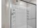 Modern walk-in shower with glass door and built-in shelving at 8346 Vinamala Ave, Las Vegas, NV 89149