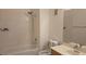 Bathroom with a tub and shower combo with tiled walls, plus vanity and sink at 8725 W Flamingo Rd # 216, Las Vegas, NV 89147