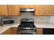 Kitchen featuring stainless steel appliances, light wood cabinets, and laminate countertops, ready for cooking at 8725 W Flamingo Rd # 216, Las Vegas, NV 89147