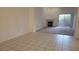 Spacious living room featuring a fireplace, sliding glass doors, and carpet adjacent to tiled floors at 8725 W Flamingo Rd # 216, Las Vegas, NV 89147