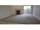 Carpeted living room with fireplace and access to a private outdoor balcony at 8725 W Flamingo Rd # 216, Las Vegas, NV 89147