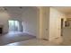 Bright living area with fireplace, patio access, and open flow to the kitchen at 8725 W Flamingo Rd # 216, Las Vegas, NV 89147