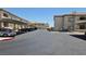 Wide view of the parking area with apartments and covered parking spaces at 8725 W Flamingo Rd # 216, Las Vegas, NV 89147