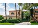 Attractive Mediterranean style home with lush landscaping and tiled roof at 9001 Opus Dr, Las Vegas, NV 89117