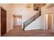 Grand foyer features high ceilings, staircase, and wood floors at 9001 Opus Dr, Las Vegas, NV 89117