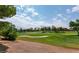 Beautiful golf course view with lush green fairways and mature trees at 9001 Opus Dr, Las Vegas, NV 89117