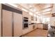 Modern kitchen featuring stainless steel appliances and light wood floors at 9001 Opus Dr, Las Vegas, NV 89117