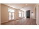 Bright living room with wood floors, fireplace, and abundant natural light at 9001 Opus Dr, Las Vegas, NV 89117