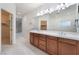 Primary bathroom vanity features double sinks, ample counter space, and abundant natural light at 9236 Whitekirk Pl, Las Vegas, NV 89145
