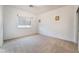 Bright bedroom features plush carpet, neutral walls, and a window for natural light at 9236 Whitekirk Pl, Las Vegas, NV 89145