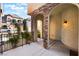 Inviting entryway with stone arches and a warm, welcoming ambiance, leading into a cozy home at 9236 Whitekirk Pl, Las Vegas, NV 89145