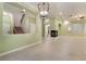 Expansive living room with tiled floors, a modern fireplace, and abundant natural light at 9236 Whitekirk Pl, Las Vegas, NV 89145