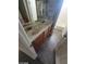 Bathroom with dual sinks, wood cabinets, tile floors, and a shower/tub combination at 9622 Staff Ln, Las Vegas, NV 89178