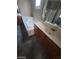 Bathroom with separate tub, vanity with wood cabinets, and neutral countertop at 9622 Staff Ln, Las Vegas, NV 89178