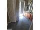 Bathroom featuring a double vanity, tile flooring, and a door to the outside at 9622 Staff Ln, Las Vegas, NV 89178
