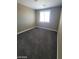 A cozy bedroom with plush carpet and a bright window is move in ready at 9622 Staff Ln, Las Vegas, NV 89178