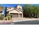 Charming stucco home with a two-car garage and manicured landscaping, offering great curb appeal at 9622 Staff Ln, Las Vegas, NV 89178