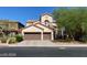 Elegant two-story home featuring a tile roof, stucco facade, and a spacious two-car garage at 9622 Staff Ln, Las Vegas, NV 89178