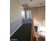 Upstairs hallway featuring views of the open floor plan and stair access at 9622 Staff Ln, Las Vegas, NV 89178