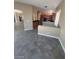 Open floor plan with tile floors leading to the kitchen at 9622 Staff Ln, Las Vegas, NV 89178